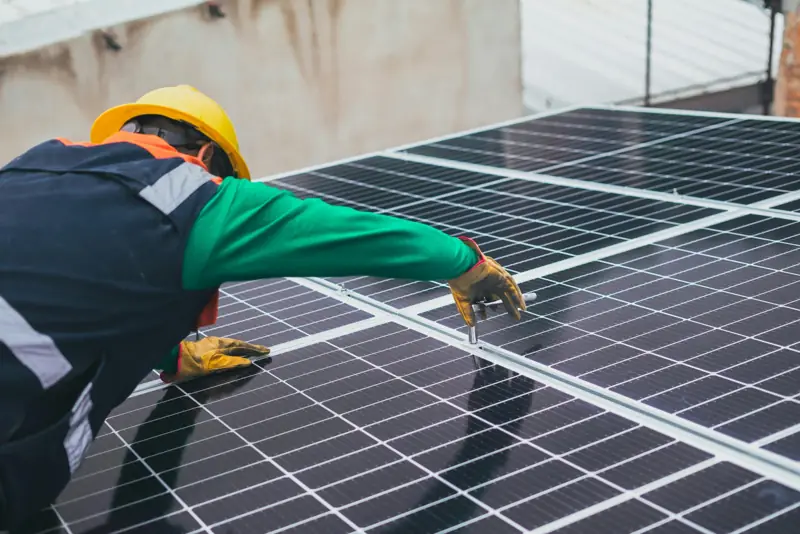 Technicians installing solar panels